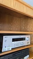 Front view of Yamaha HTR-5750 receiver on shelf