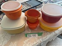 Group view of all Tupperware pieces on table