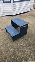 Front view of blue plywood two-step stool