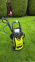 Front view of Sun Joe SPX3000 XTREAM pressure washer showing branding, hose, lance, detergent tank