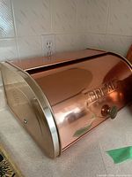 Copper bread box front and side view