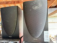 front view of Pioneer bookshelf speakers with cloth grilles