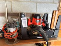 Overall lot showing Black & Decker Router Crafter with router, heat gun and additional router