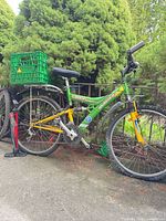 Full view of bike showing frame color, crate basket, and floor pump