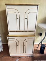 Full view of stacked two-piece cabinet set showing overall design and wear