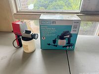 Boxed Paint It spray gun beside Krebs 35T sprayer