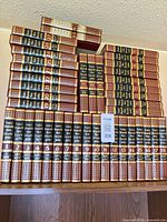 All Funk & Wagnalls New Encyclopedia books showing volumes 1-27 and extra duplicates