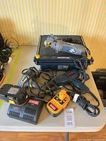Overview of all power tools and chargers on table