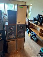 Front view of stacked speakers showing various cabinet types