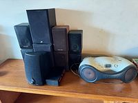 Group shot of Sony boombox and stacked speakers on shelf