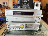 Pioneer receiver stacked above JVC cassette deck, full frontal view