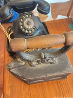 Overall view of Bakelite rotary telephone on cast iron base