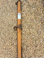 Full view of wooden beam with attached yoke hardware