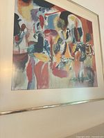 front view of abstract print showing colors, mat and metal frame