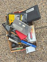 Overall view of mixed tools in cardboard tray