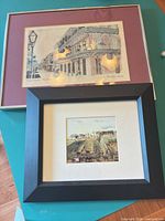 Both framed prints side by side showing overall appearance, frames, mats and glass