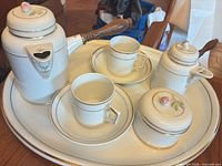 Full view of all eight porcelain pieces on tray