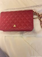 Front view showing quilted leather, gold logo