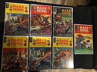Group shot of eight M.A.R.S. Patrol: Total War issues #1-8