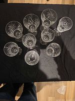 overhead view of all nine cut crystal glasses showing pattern