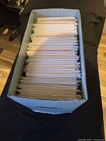 Short comic banker box filled with vertically stored bagged comic books