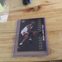 Front view of card in protective case on wood surface