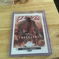 Front view of Michael Jordan MVP Checklist card inside plastic holder