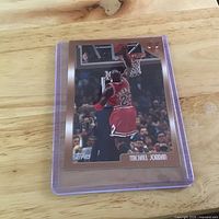 Front view of Michael Jordan Topps card in toploader