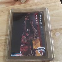 Card in plastic sleeve showing front image and branding