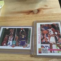 Both cards in holders side by side on table