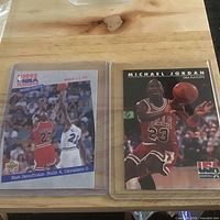 Two cards side by side in sleeves: 1993 Playoffs Highlights and USA Basketball Playoffs card
