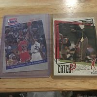 Both Jordan cards side by side in sleeves