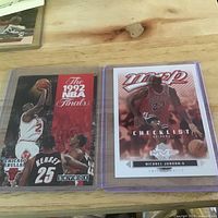 Both cards in sleeves side by side