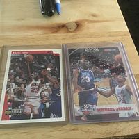 Both Michael Jordan trading cards side by side