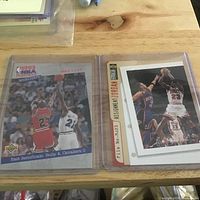Both cards in plastic sleeve: 1993 Playoffs Highlights card left, Assignment: Jordan binder card right