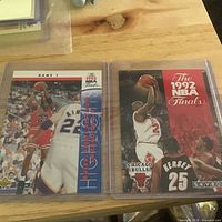 Two NBA Finals card sheets in plastic sleeves
