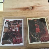 Two Jordan's Greatest Hits cards in sleeves, front view