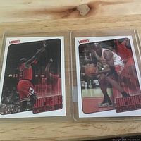 Two Michael Jordan Victory cards side by side in sleeves