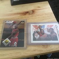 Upper Deck Jordan action card and Bulls Starting Team ’90 commemorative card in sleeves