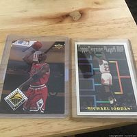 Both Michael Jordan trading cards side by side