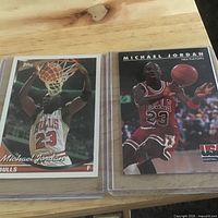 Both Michael Jordan cards in sleeves showing fronts