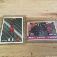 Front view of both Michael Jordan cards in plastic holders