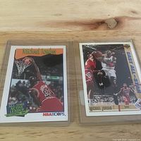 Front view of both Michael Jordan cards in sleeves