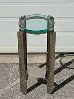 Full view of side table front angle showing glass top and stainless frame