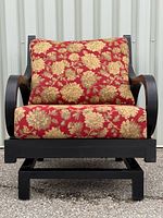 Front view of lounge chair showing frame and floral cushions