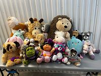 Front view of entire plush collection on table