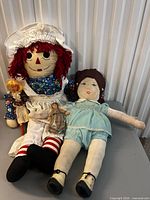 All four dolls arranged on table