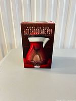 Front view of boxed Williams Sonoma Froth & Pour Hot Chocolate Pot