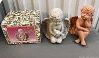 Both ceramic angels and floral box displayed