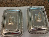Top view of both covered serving dishes showing matching design, lids in place